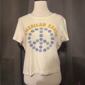 American Eagle Outfitters Cream Tee with Floral Peace Sign
